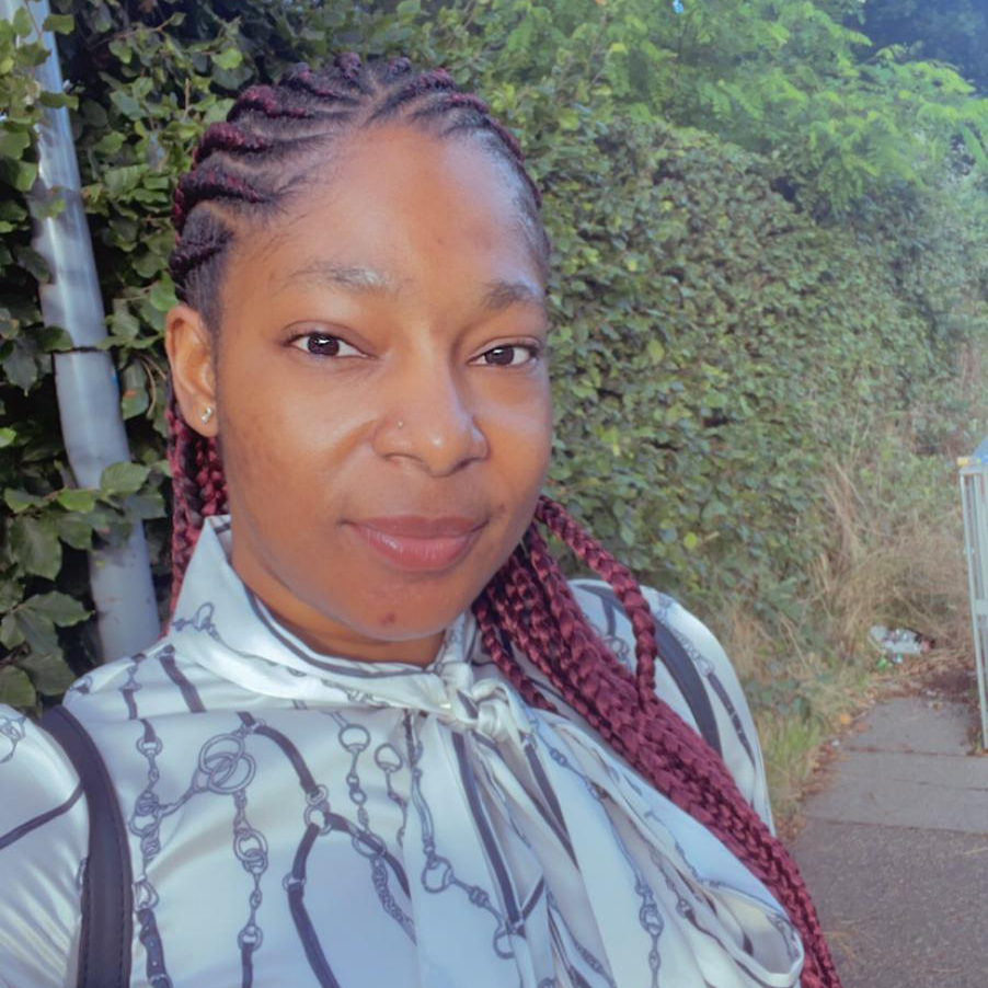 A black woman with hear in neat braids
