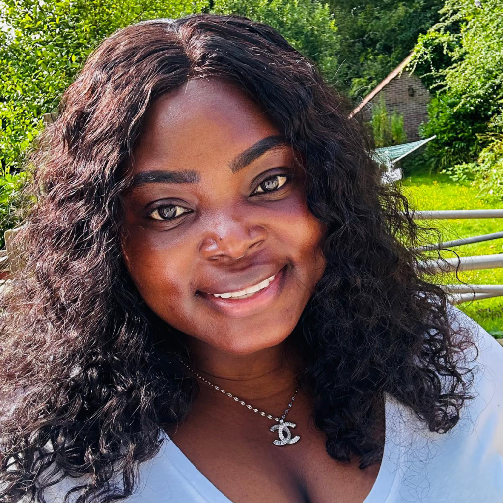 A young black woman with long curly hair